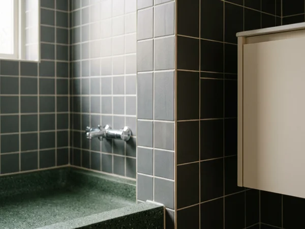 Restored bathroom with scrubbed tile and fresh grout after decontamination