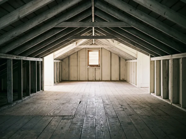 Clean attic space with bare joists after vermiculite removal